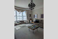 Guest sitting room with bay window overlooking the garden